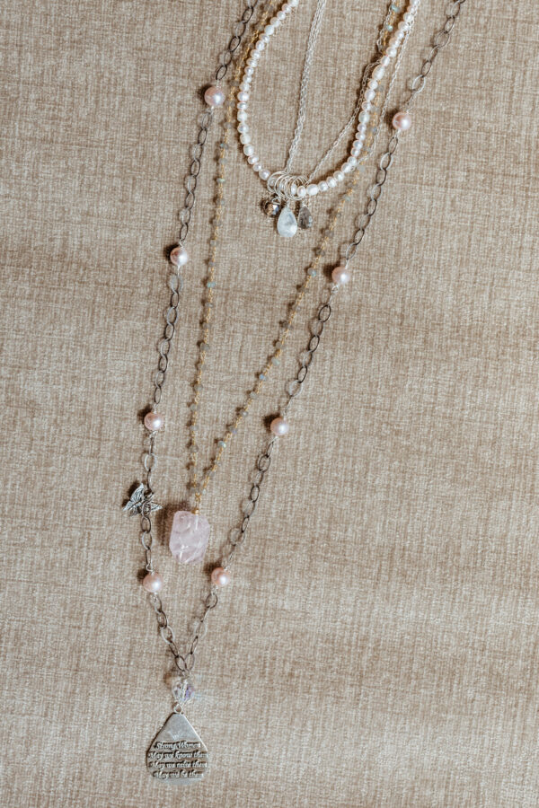 A Necklace With Silver Chains and Pearls